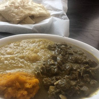 Joy's Roti Delight - Curry goat with buss up shot with dhal and pumpkin - Indian Near Me - Lauderhill, Florida Joy's Roti Delight - Curry goat with buss up shot with dhal and pumpkin - Indian Near Me - Lauderhill, Florida