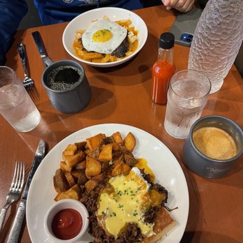 Full Belly - Barbacoa breakfast poutine (top) eggs Benny (bottom) black coffee (top) crème brûlée coffee (bottom) - Breakfast & Brunch Near Me - San Antonio, Texas Full Belly - Barbacoa breakfast poutine (top) eggs Benny (bottom) black coffee (top) crème brûlée coffee (bottom) - Breakfast & Brunch Near Me - San Antonio, Texas