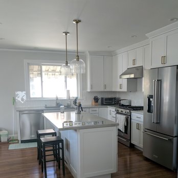 dconstrux - a kitchen with stainless steel appliances - General Contractors Near Me dconstrux - a kitchen with stainless steel appliances - General Contractors Near Me