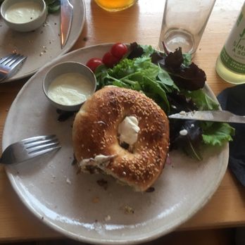 Holy Bagels - Nina Bagel with salad on the side - Coffee & Tea Near Me - Brussels, BRU Holy Bagels - Nina Bagel with salad on the side - Coffee & Tea Near Me - Brussels, BRU