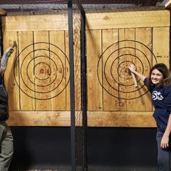 Cascadia Axe - Father and son in our mobile axe-throwing trailer! Cascadia Axe Company is family-owned and operated!