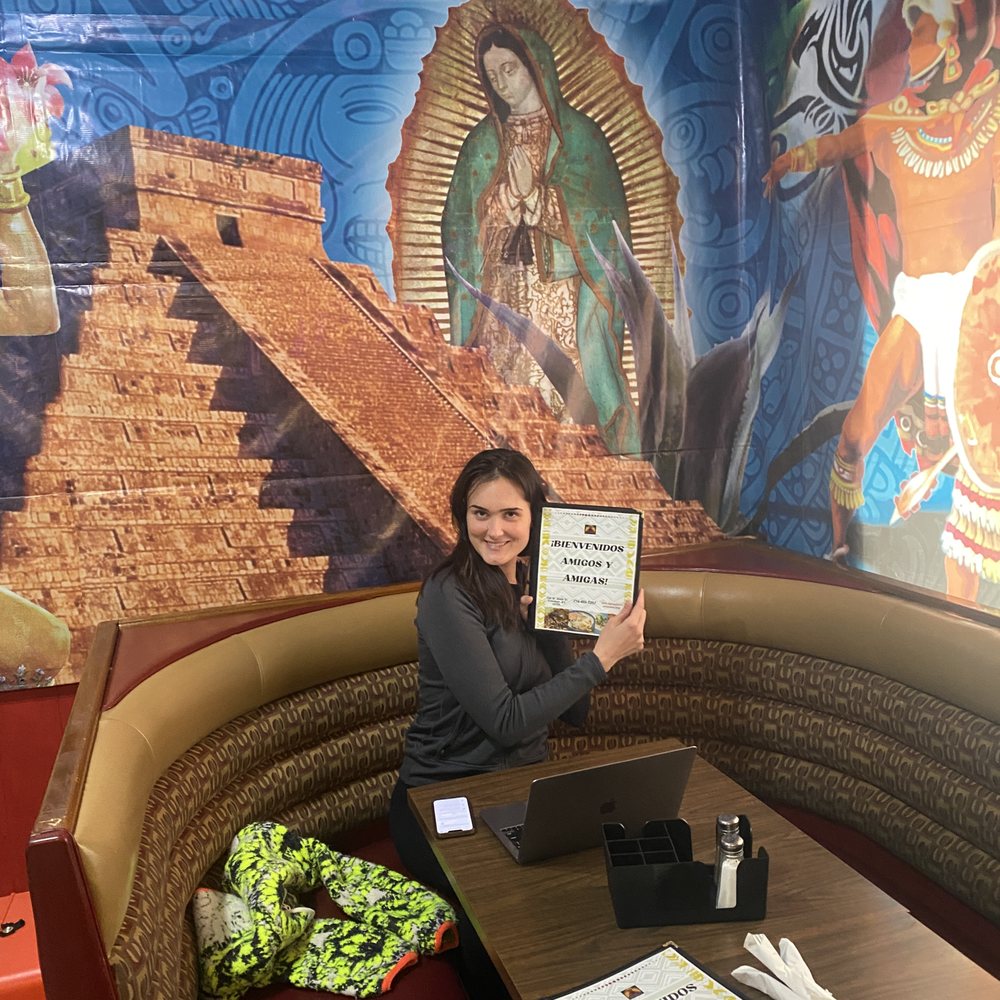 Azteca Mexican Diner - Menu and wall art behind booth - Mexican Near Me - Falconer, New York Azteca Mexican Diner - Menu and wall art behind booth - Mexican Near Me - Falconer, New York