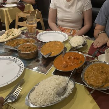 Delhi Palace - Garlic naan, mango chicken, patar paneer, madrasi lamb and bengan bhartha with white rice, and chai tea and mango lassi for the drinks - Indian Near Me - Flagstaff, Arizona Delhi Palace - Garlic naan, mango chicken, patar paneer, madrasi lamb and bengan bhartha with white rice, and chai tea and mango lassi for the drinks - Indian Near Me - Flagstaff, Arizona