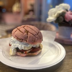 Frida's Mexican Ice Cream - Concha rellena with strawberries, banana, Nutella, whip cream, and Cookie Monster ice cream