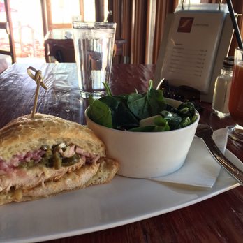 Red Tail Grill - Spicy grilled chicken sandwich with spinach salad with apple and cranberries - New American Near Me - Park City, Utah Red Tail Grill - Spicy grilled chicken sandwich with spinach salad with apple and cranberries - New American Near Me - Park City, Utah