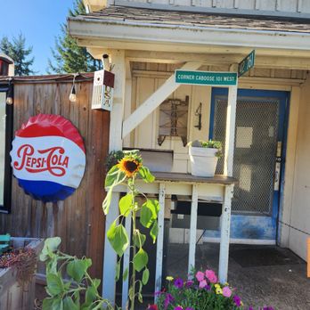 The Corner Caboose - a pepsi cola sign and flowers - Sandwiches Near Me - Port Angeles, Washington The Corner Caboose - a pepsi cola sign and flowers - Sandwiches Near Me - Port Angeles, Washington