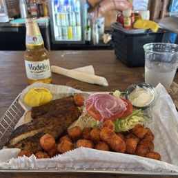 Blackened Tripletail fish sandwich with sweet potato tots - delicious! Blackened Tripletail fish sandwich with sweet potato tots - delicious!