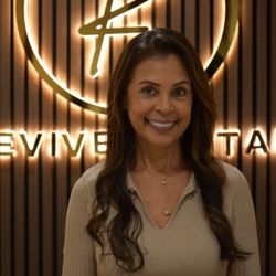 Revive Dental - Happy female patient smiling at Revive Dental