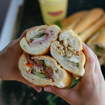 Obanhmi - a person holding a sandwich in their hand - Vietnamese Near Me - Burnaby, British Columbia Obanhmi - a person holding a sandwich in their hand - Vietnamese Near Me - Burnaby, British Columbia