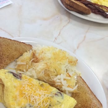 Jerry Bob's Family Restaurant - Cheese bacon eggs omelette with hash browns and bread. The wife had pancakes eggs and bacon - Breakfast & Brunch Near Me - Tucson, Arizona