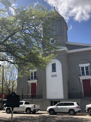 Photo of First African Baptist Church - Savannah, GA, US. The front of the church with the red doors signifying a safe space and that the church's mortgage is "paid off".