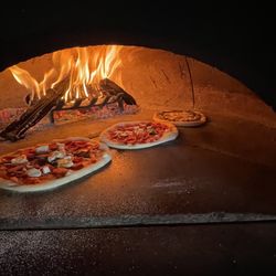 Pizzas are cooked fresh in our Italian imported oven!