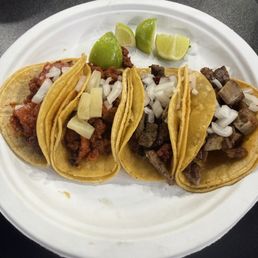 Left to right. Taco de chicharrón prensado, taco de pastor with pineapple, taco campechano(steak and pastor) and taco de suadero. Left to right. Taco de chicharrón prensado, taco de pastor with pineapple, taco campechano(steak and pastor) and taco de suadero.