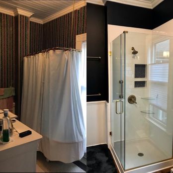 Custom Construction & Renovations - Navy bathroom with hardwood floors and glass shower enclosure. - General Contractors Near Me