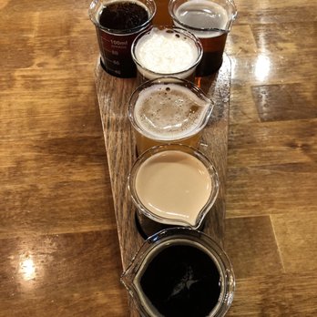 Beer Lab - Ghostface Brewing - Beer flight of 7 served in a coffin holder & beaker glasses - Breweries Near Me - Mooresville, North Carolina