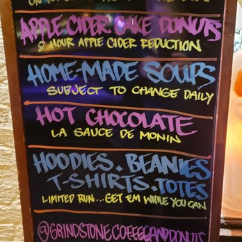 Grindstone Coffee & Donuts - Outside sandwich board sign, oddly posted on the wall . . . but it's contents are provocative! - Donuts Near Me - Sag Harbor, New York Grindstone Coffee & Donuts - Outside sandwich board sign, oddly posted on the wall . . . but it's contents are provocative! - Donuts Near Me - Sag Harbor, New York