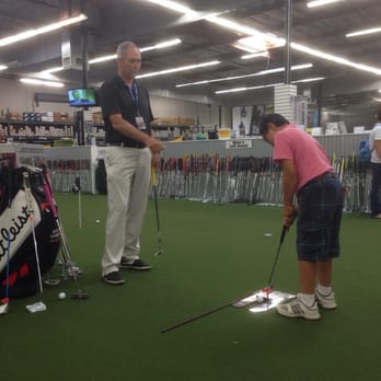 Roger Dunn Golf Shops - Teaching little customer to putt. - Golf Equipment Near Me - Seal Beach, California Roger Dunn Golf Shops - Teaching little customer to putt. - Golf Equipment Near Me - Seal Beach, California