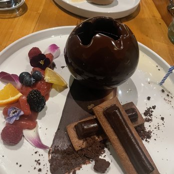 Morimoto Napa - Chocolate bomb with ice cream, chocolate cake and whip cream inside - Japanese Near Me - Napa, California