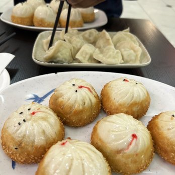 Happy Bao's - 12. Chicken Sheng Jian Bao and 4. Chicken Cabbage Dumplings in back 2. Pork Cabbage Dumplings - Chinese Near Me - Mesa, Arizona Happy Bao's - 12. Chicken Sheng Jian Bao and 4. Chicken Cabbage Dumplings in back 2. Pork Cabbage Dumplings - Chinese Near Me - Mesa, Arizona