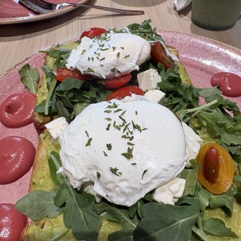 Cafe Crème de la Crème - Avocado toast and apple rose in the background - Cafes Near Me - Naples, Florida Cafe Crème de la Crème - Avocado toast and apple rose in the background - Cafes Near Me - Naples, Florida