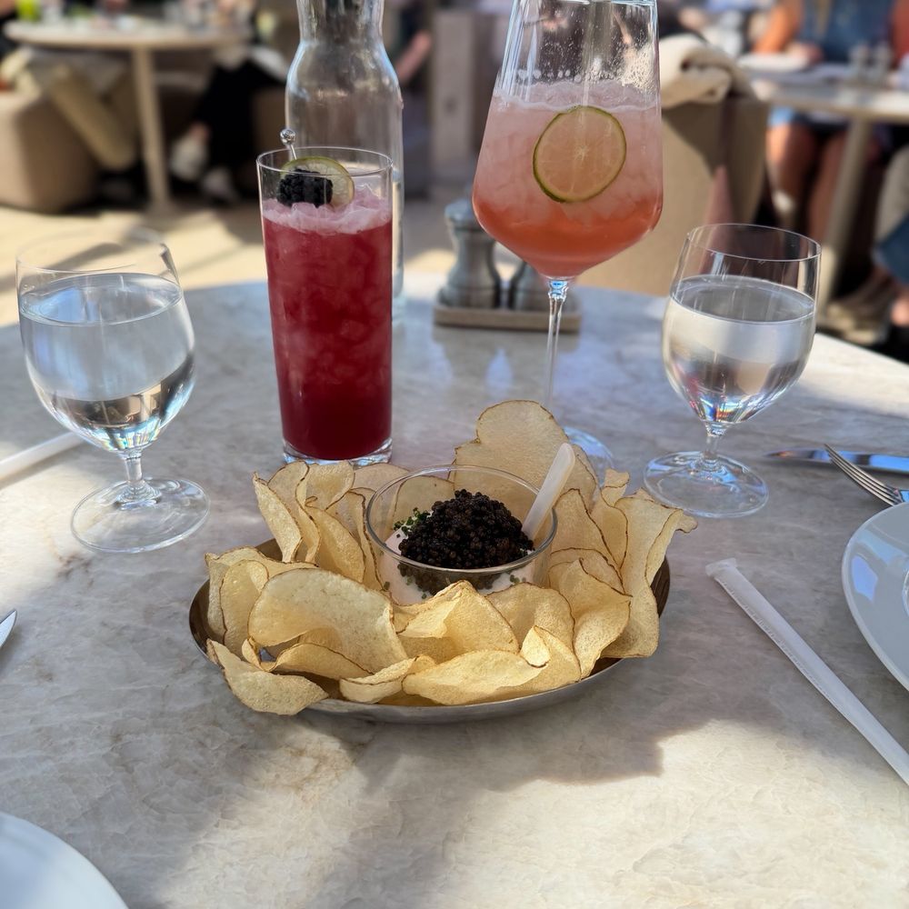 Caviar and potato chips, Blackberry Mocktail and a Spritz to start Caviar and potato chips, Blackberry Mocktail and a Spritz to start