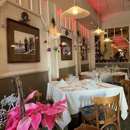 festive interior of Duc's Bistro plus a Christmas plant in the bottom left corner that I put on our table