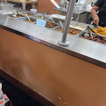 Rice & Beans II - a woman and a child at a buffet - Spanish Near Me - York, Pennsylvania Rice & Beans II - a woman and a child at a buffet - Spanish Near Me - York, Pennsylvania
