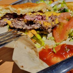 Too pink for cooked burger. Too pink for cooked burger.