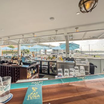 Fat Tuna - a view of a bar with tables and umbrellas - Seafood Near Me - Waterford, Connecticut Fat Tuna - a view of a bar with tables and umbrellas - Seafood Near Me - Waterford, Connecticut
