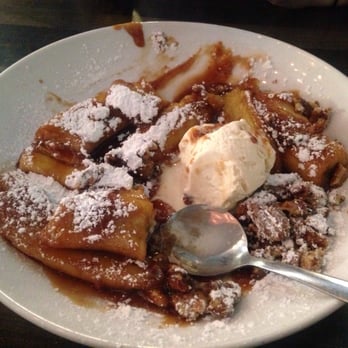 Dish Society - bananas foster: contrast the piping hot bananas & rum sauce with the vanilla ice cream, nice touch with the powdered sugar - New American Near Me - Katy, Texas