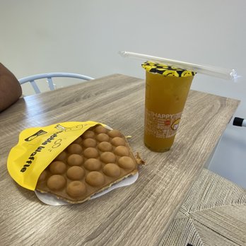 Happy lemon - a bag of almonds and a drink on a table - Coffee & Tea Near Me - Fulshear, Texas Happy lemon - a bag of almonds and a drink on a table - Coffee & Tea Near Me - Fulshear, Texas