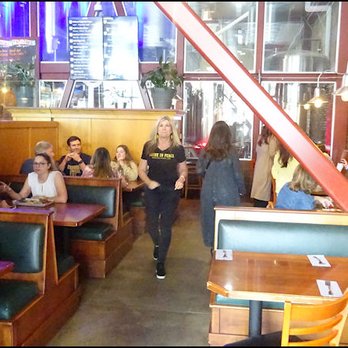 Auburn Alehouse - The dining room is split in two sides by a partition, between the bar and the dining room, and features furniture of tables and booths. - American Near Me - Auburn, California