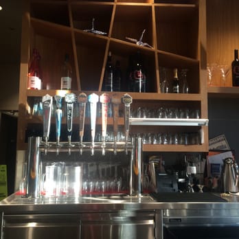 The Bulldog - a bar with a lot of glasses on it - New American Near Me - Spokane, Washington
