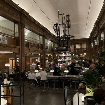 Founders Club - people sitting at tables in the lobby - Speakeasies Near Me - Seattle, Washington Founders Club - people sitting at tables in the lobby - Speakeasies Near Me - Seattle, Washington