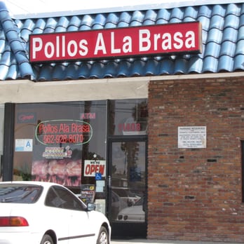 Pollos A La Brasas - a car parked in front of a restaurant - Peruvian Near Me - Downey, California