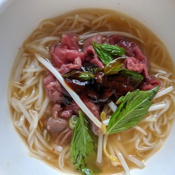 Pho Metro - Pho with rare beef in spicy satay noodles. Got this to-go and this is my 3rd bowl so the colour of the broth is not as bright. Still good! - Vietnamese Near Me - Scarborough, Ontario Pho Metro - Pho with rare beef in spicy satay noodles. Got this to-go and this is my 3rd bowl so the colour of the broth is not as bright. Still good! - Vietnamese Near Me - Scarborough, Ontario