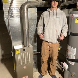 Ace Heating and Air - Worker with furnace he installed