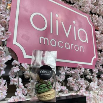 Olivia Macaron - a display of macarons in front of a pink sign - Macarons Near Me - Washington, DC, District of Columbia Olivia Macaron - a display of macarons in front of a pink sign - Macarons Near Me - Washington, DC, District of Columbia