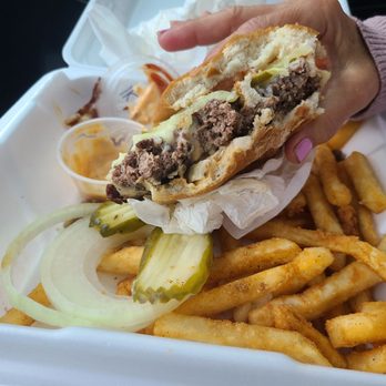Sandy's Place Restaurant - The half eaten burger, look at the thickness of that patty and those delicious fries! - American Near Me - Scott City, Missouri