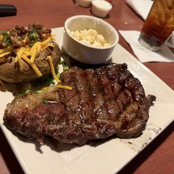 O'Charley's Restaurant & Bar - Steak with bleu cheese crumbles, loaded baked potato and mac n cheese - American Near Me - Owensboro, Kentucky