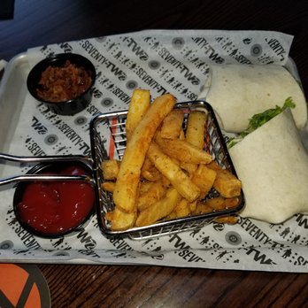 72 Tavern & Grill - Cali Club Wrap $11. sliced turkey / bacon / avocado smash / lettuce / tomato /homemade vinaigrette / white wrap - Sports Bars Near Me - Utica, New York 72 Tavern & Grill - Cali Club Wrap $11. sliced turkey / bacon / avocado smash / lettuce / tomato /homemade vinaigrette / white wrap - Sports Bars Near Me - Utica, New York