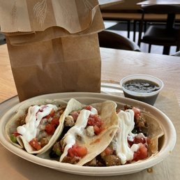 Chicken taco combo with salsa.