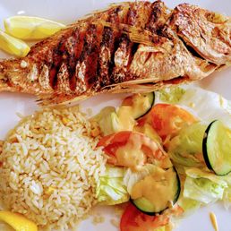 3/29/24  Wonderfully fried crispy moist red snapper fish with rice & salad.
