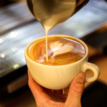 Great Harvest Bakery + Café - a latte being poured into a cup - Bakeries Near Me - Burlington, Vermont Great Harvest Bakery + Café - a latte being poured into a cup - Bakeries Near Me - Burlington, Vermont