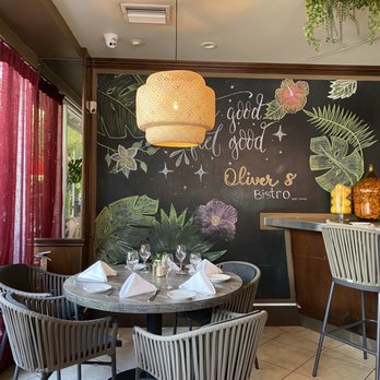 Oliver's Bistro - a table and chairs in a restaurant - Breakfast & Brunch Near Me - Miami Beach, Florida