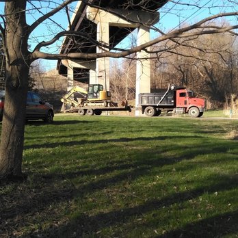 TruDirt - a red truck parked under a bridge - Masonry/Concrete Near Me - Lake View, New York