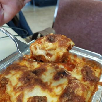 Deluca Fine Foods - a close up of a serving of lasagna - Delicatessen Near Me - Port Colborne, Ontario Deluca Fine Foods - a close up of a serving of lasagna - Delicatessen Near Me - Port Colborne, Ontario