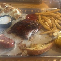 Ultimate Smokehouse Combo with Ribs, Jalapeño Sausage, Brisket Quesadilla Ultimate Smokehouse Combo with Ribs, Jalapeño Sausage, Brisket Quesadilla