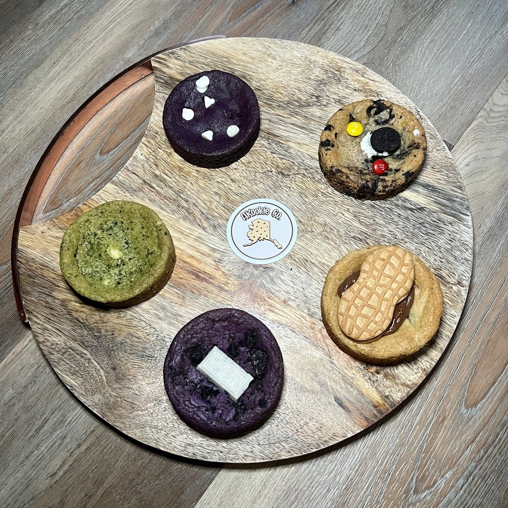 AKookie Co. - Clockwise: Ube Pride (ube stuffed with fruity pebbles Krispy), MOhREOM, PBNutt, ubelicious, and Matcha MAKadamia - Bakeries Near Me