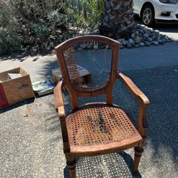 Furniture Repair and Restoration - Before restoration - chair was outside and in a storage unit for many years.